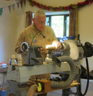 Keith Leonard turning snowmen ready for painting by his neighbour kids